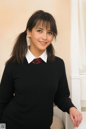 A woman in a blue uniform sitting on a bed.