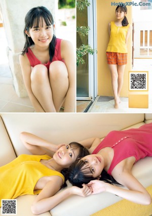 Two young women sitting next to each other on a bed.